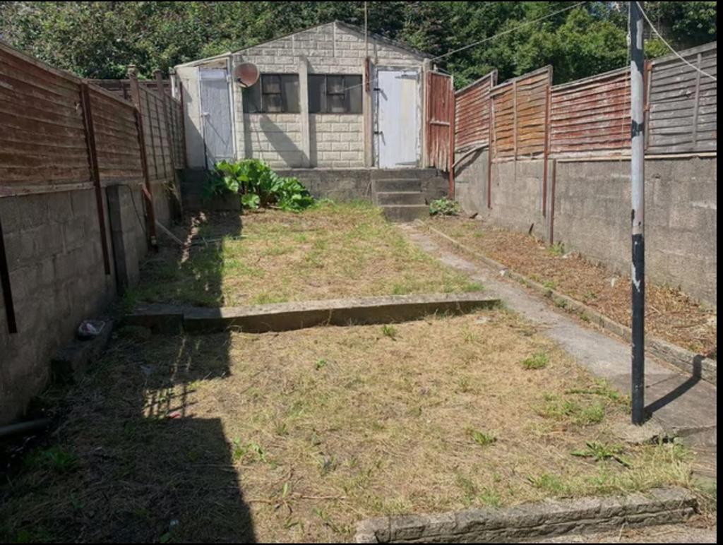 A spacious garden area with potential for outdo...