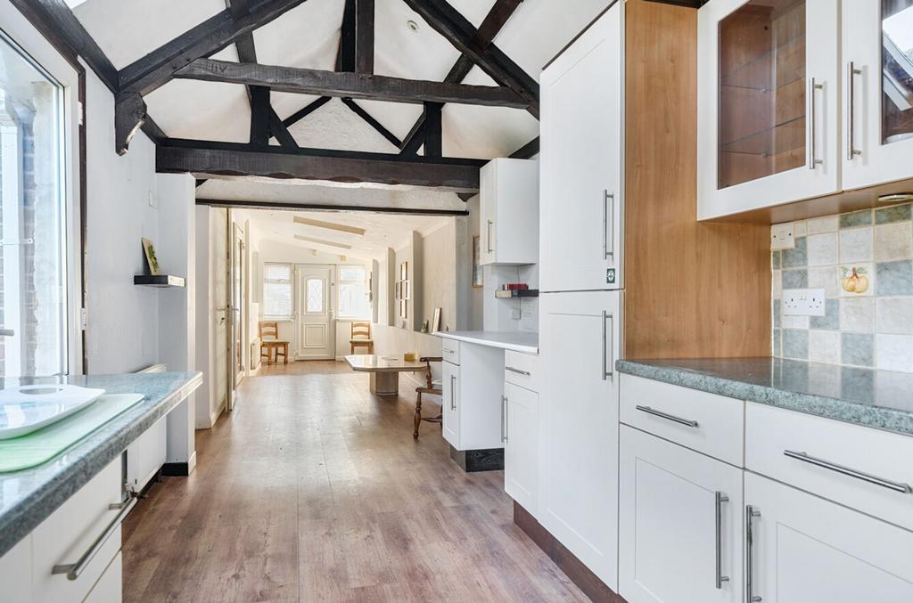 Living/dining area with kitchen/utility area
