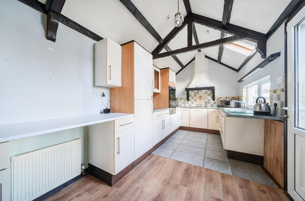 Living/dining area with kitchen/utility area