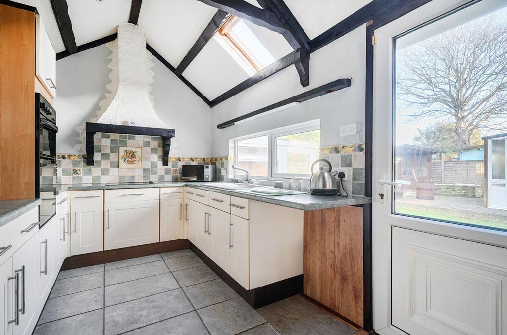 Living/dining area with kitchen/utility area