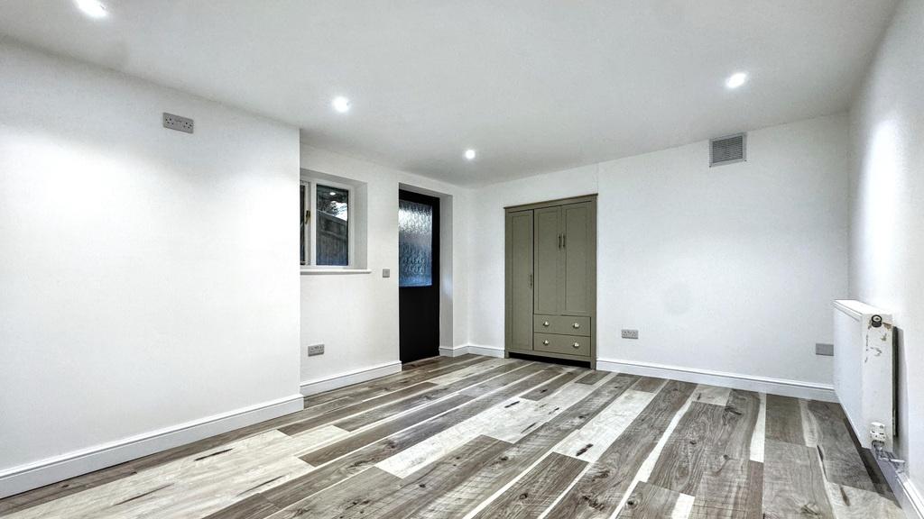 Bright, modern living space with fresh white wa...
