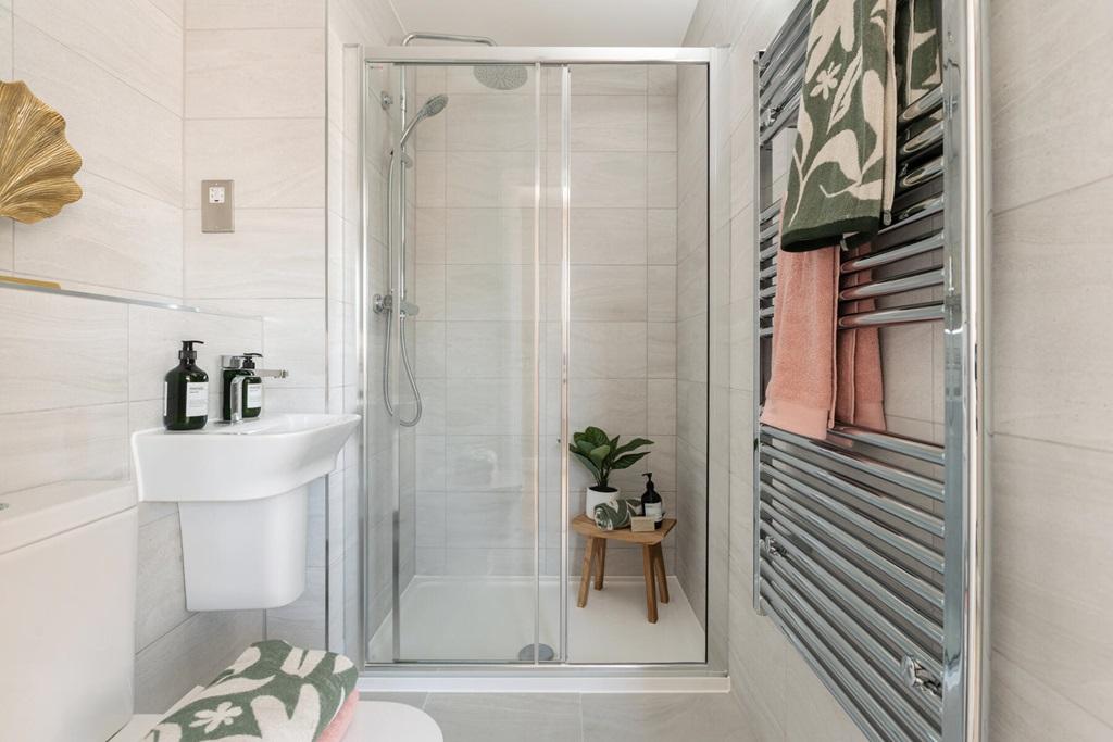 An en-suite with full width shower cubicle