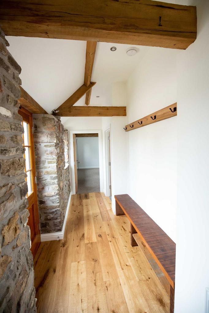 Bright, characterful hallway with exposed stone...