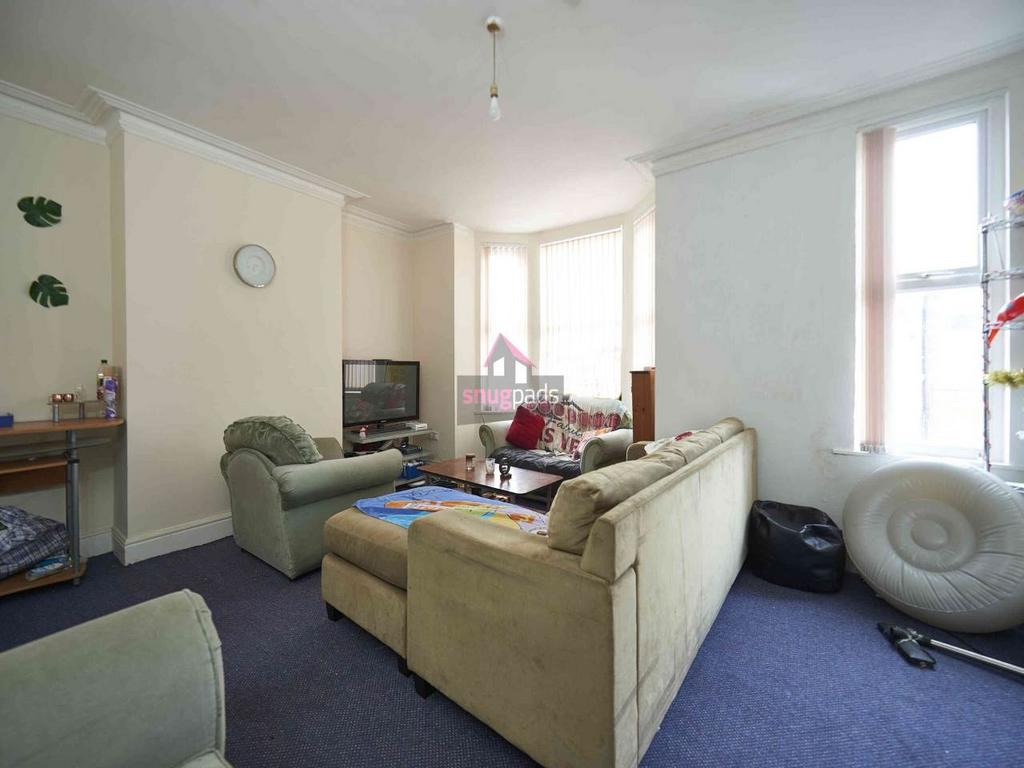 Bright, relaxed living room with comfortable so...