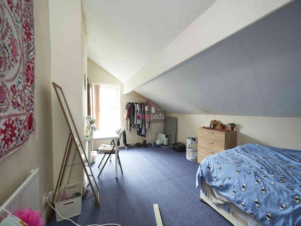 Bright attic double bedroom with sloped ceiling...