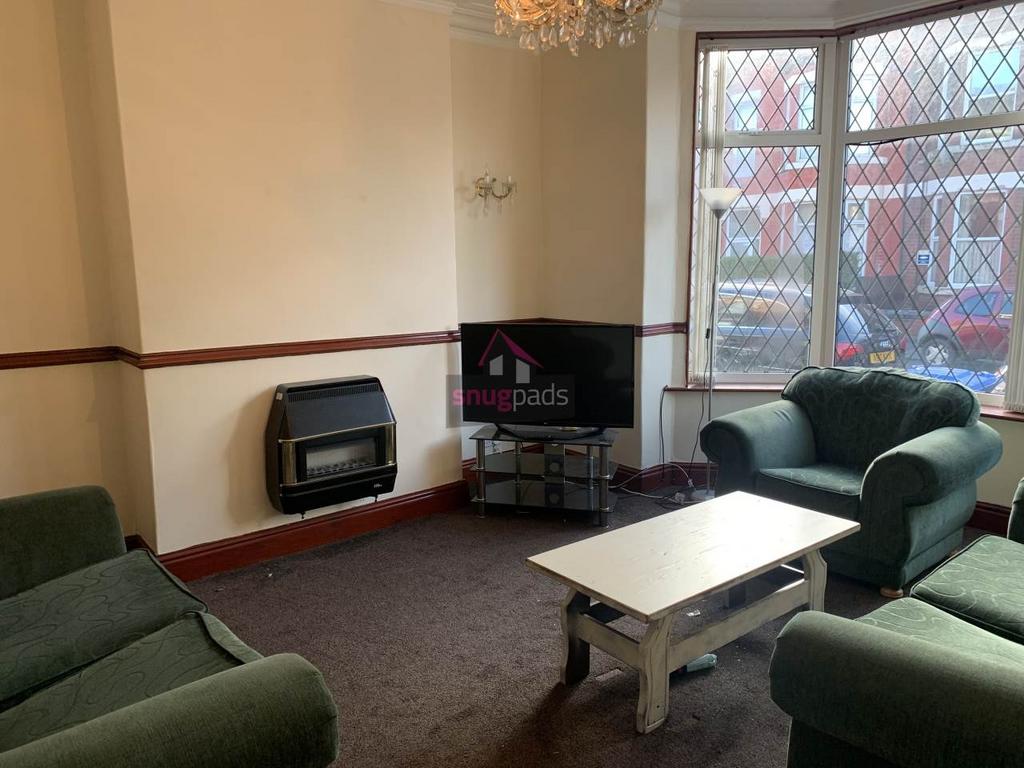 Bright, comfortable living room with classic ba...