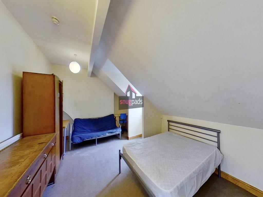 Bright attic double bedroom with sloped ceiling...