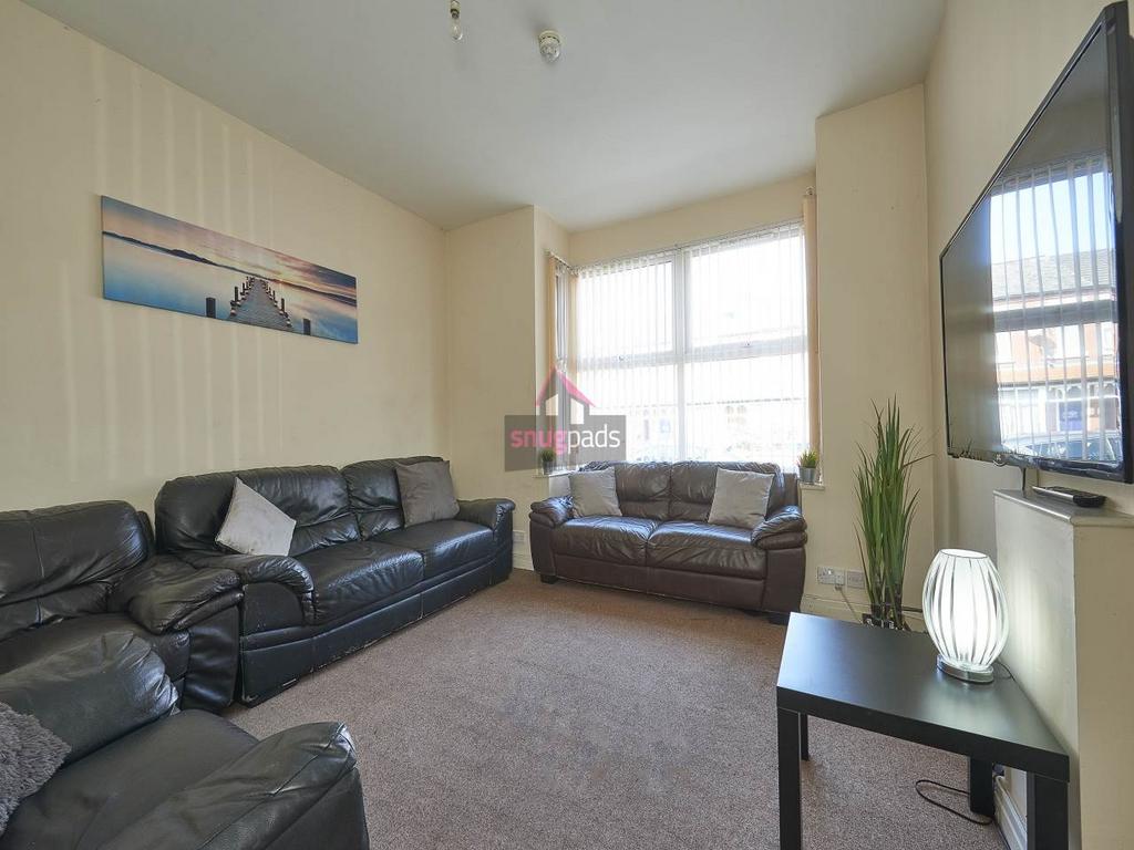 Bright, comfortable living room with matching l...