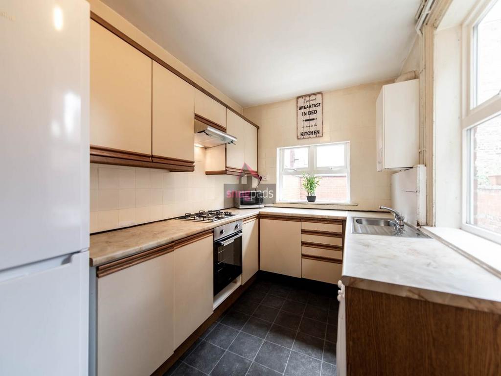 Bright, modern galley kitchen with plenty of st...