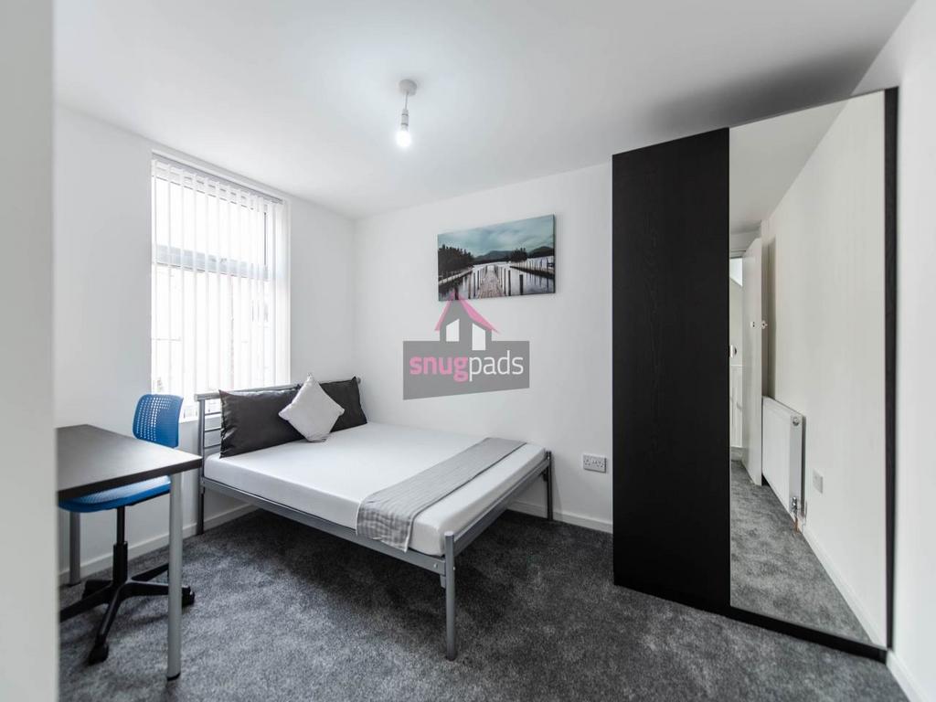 Bright, well-presented bedroom with a comfortab...