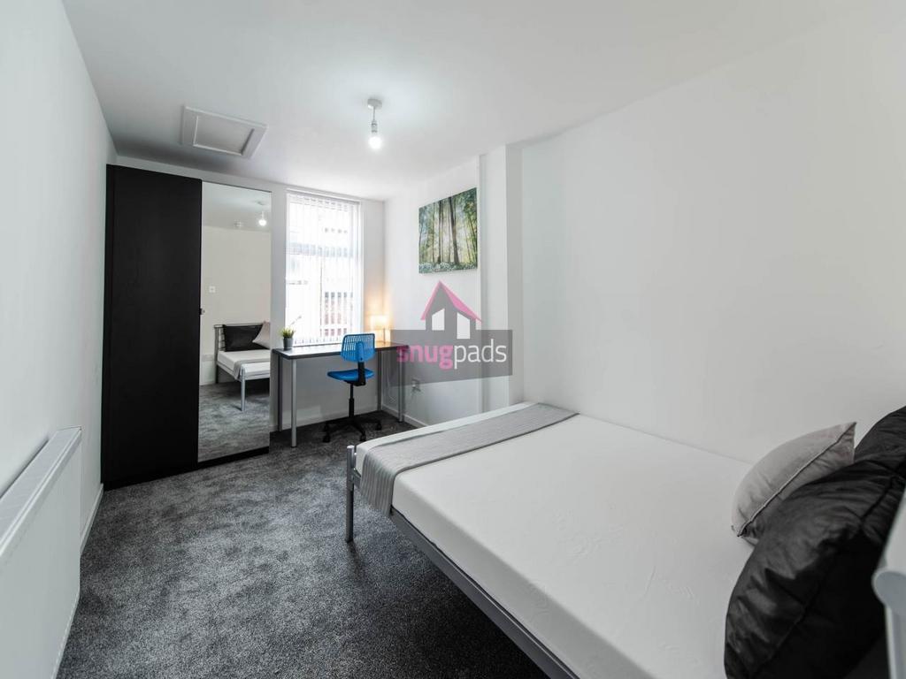Bright, modern double bedroom with a full-size ...