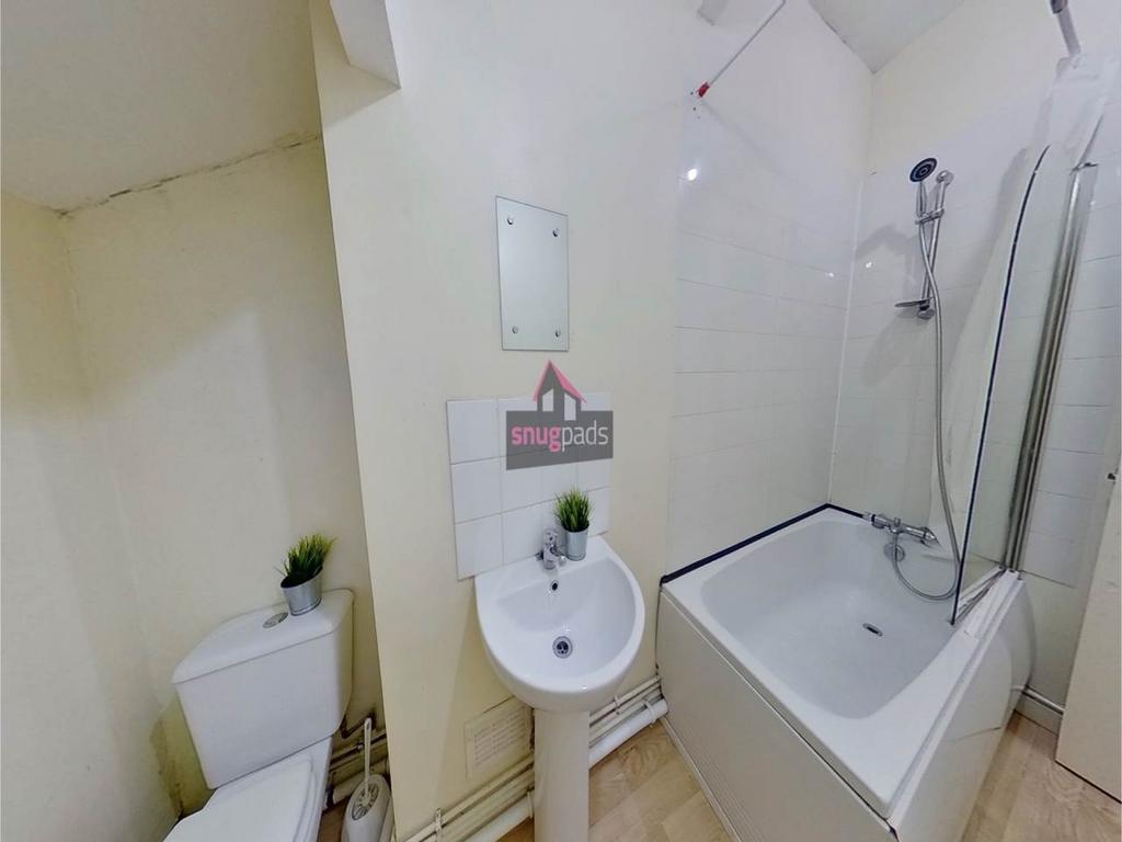 Bright, neatly presented bathroom with a modern...