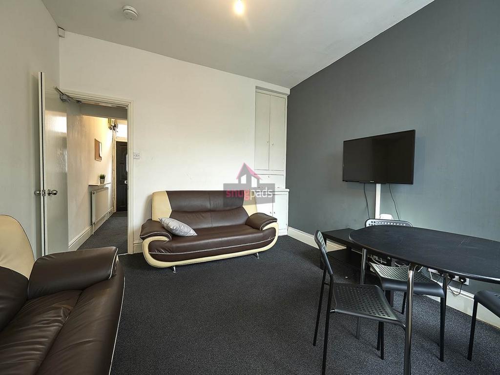 Contemporary communal living room with comforta...