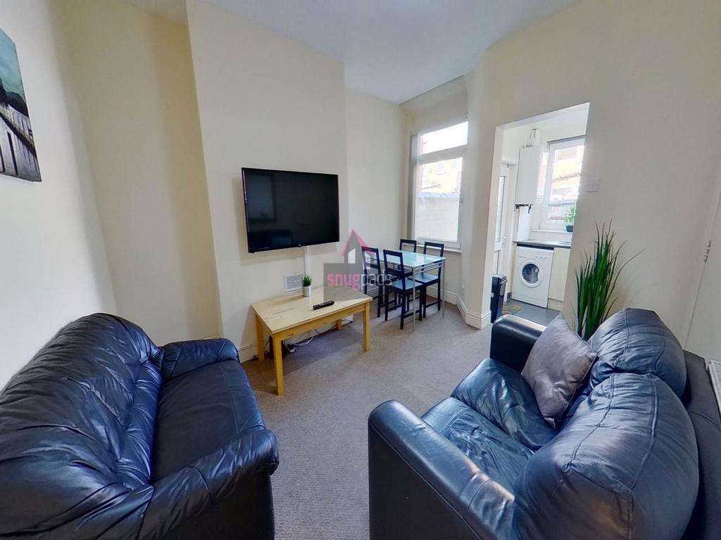 Bright, comfortably furnished living room with ...