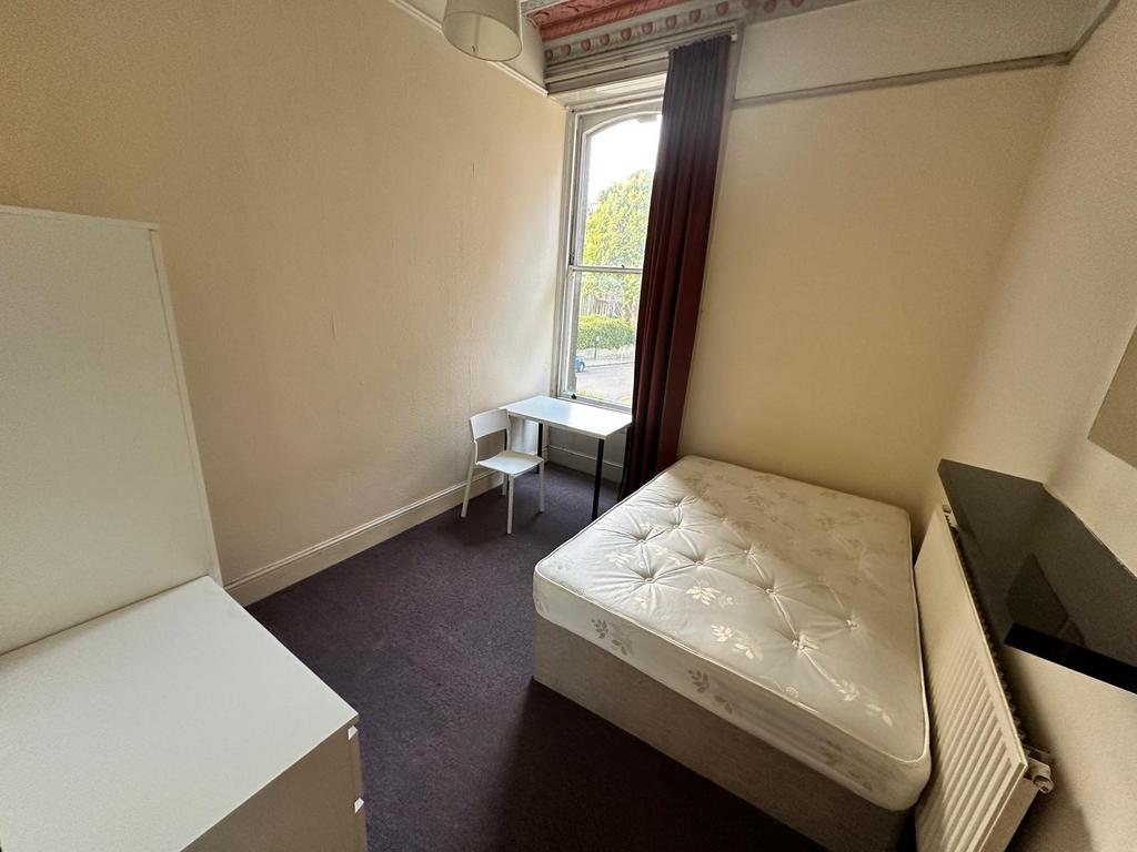 Bright bedroom with a comfortable double bed, l...