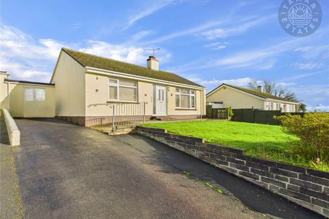undefined, “A charming two-bedroom link-detached bungalow with easy living.”