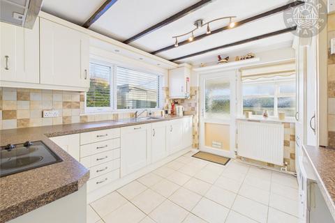 undefined, “A charming two-bedroom link-detached bungalow with easy living.”