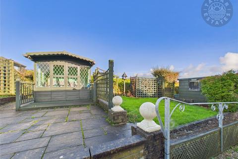 undefined, “A charming two-bedroom link-detached bungalow with easy living.”