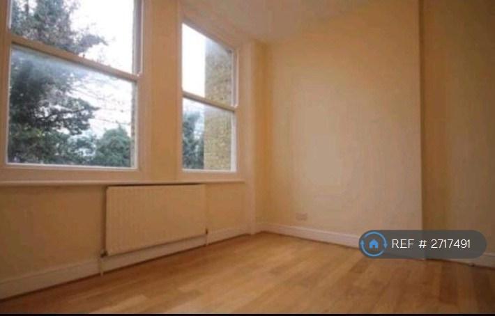 Double Bedroom With Large Windows And Ceilings