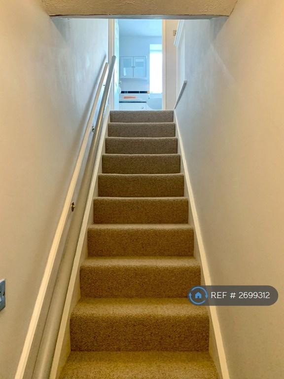 Stairs To Upper Floor With Handrail