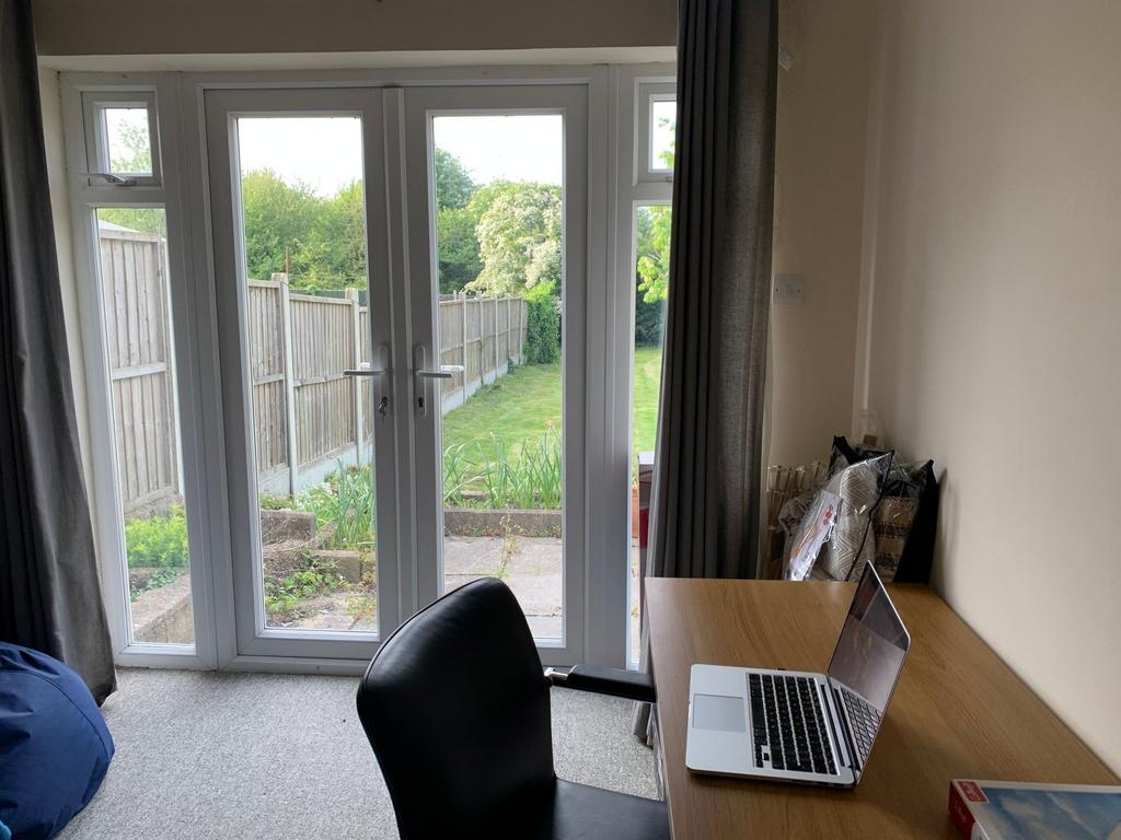 Bright rear-facing room with full-height patio ...