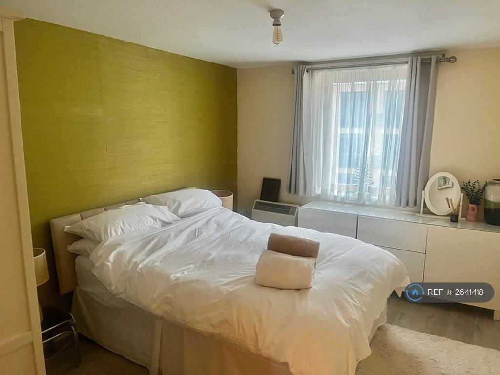 Green Bedroom With Double Bed