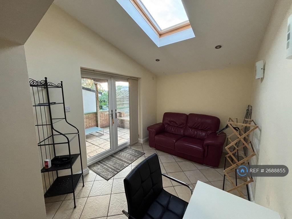 Living Area With Spare Desk And Leather Sofa