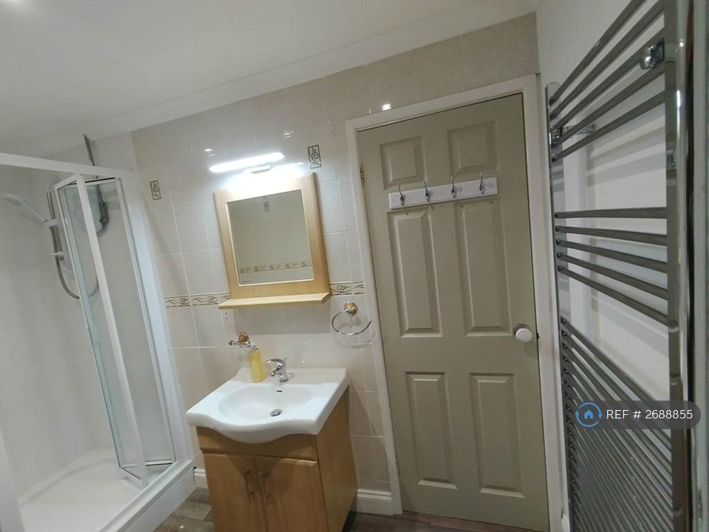 Bathroom With Sink, Towel Rail And Vanity Mirror