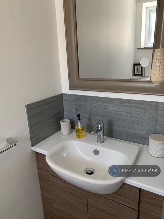 Sink And Toilet Next To Bedroom