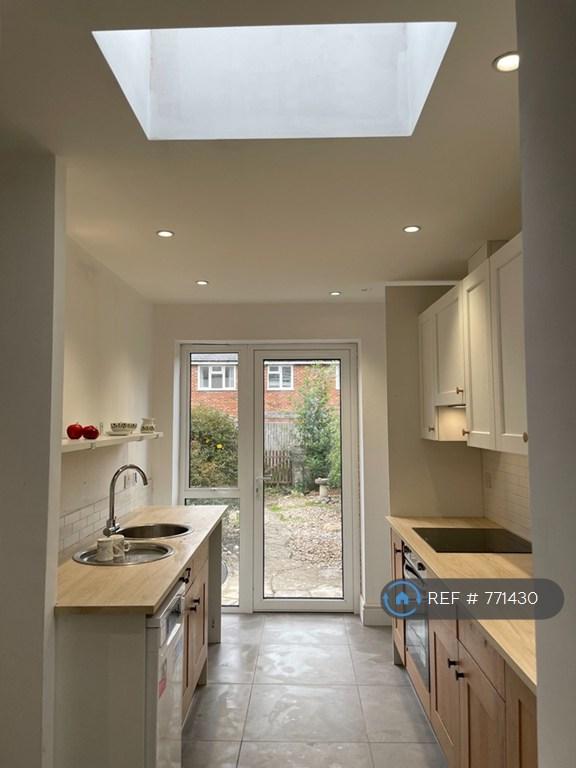Kitchen With Doors To Garden