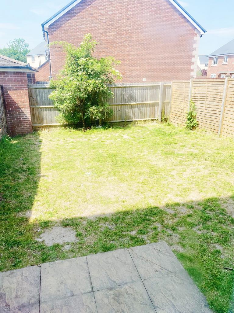 Sunny private rear garden with lawn, paved pati...