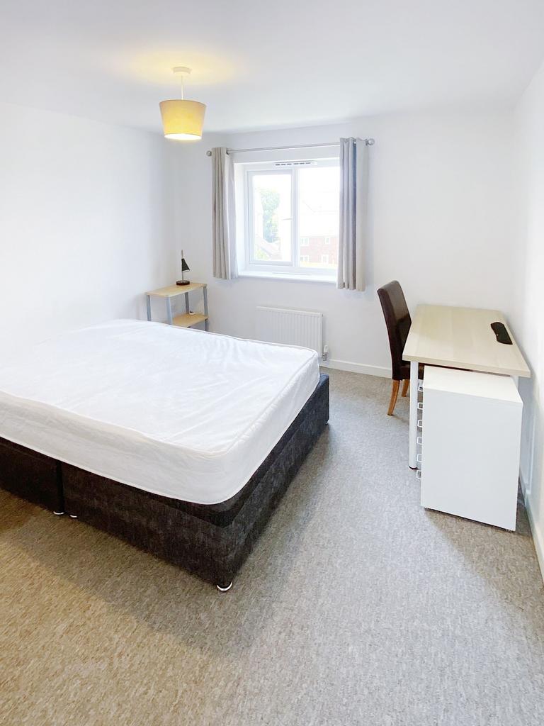 Bright, freshly decorated double bedroom with a...