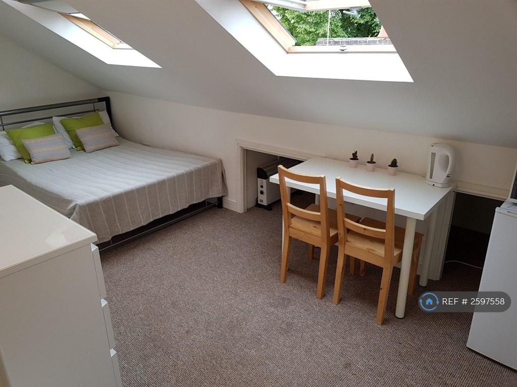 Double Bed And Dining Space