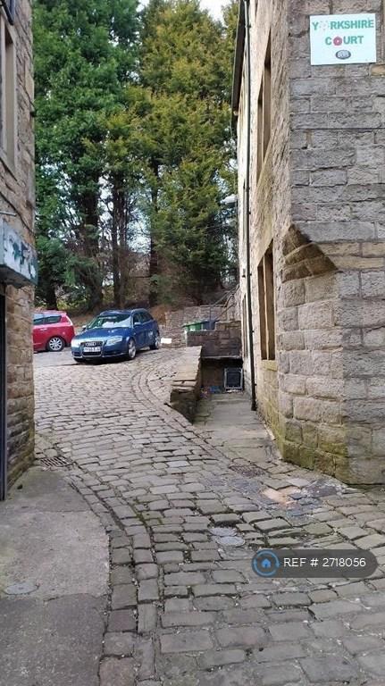 Cobbled Alleyway To Parking