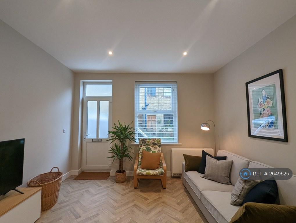 Living Area With Comfortable Seating And Smart Tv