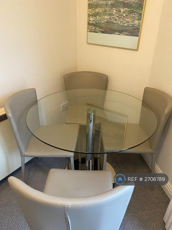 Glass Table And Chairs In Lounge