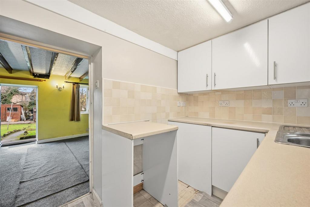 Kitchen to Sitting Room and front door.jpg