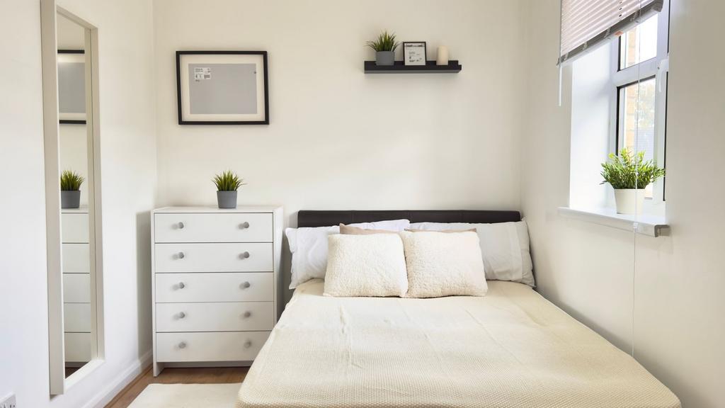 Bright and inviting double bedroom featuring a ...