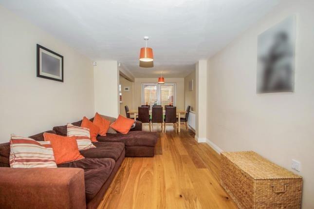 Bright, open-plan living and dining area with w...