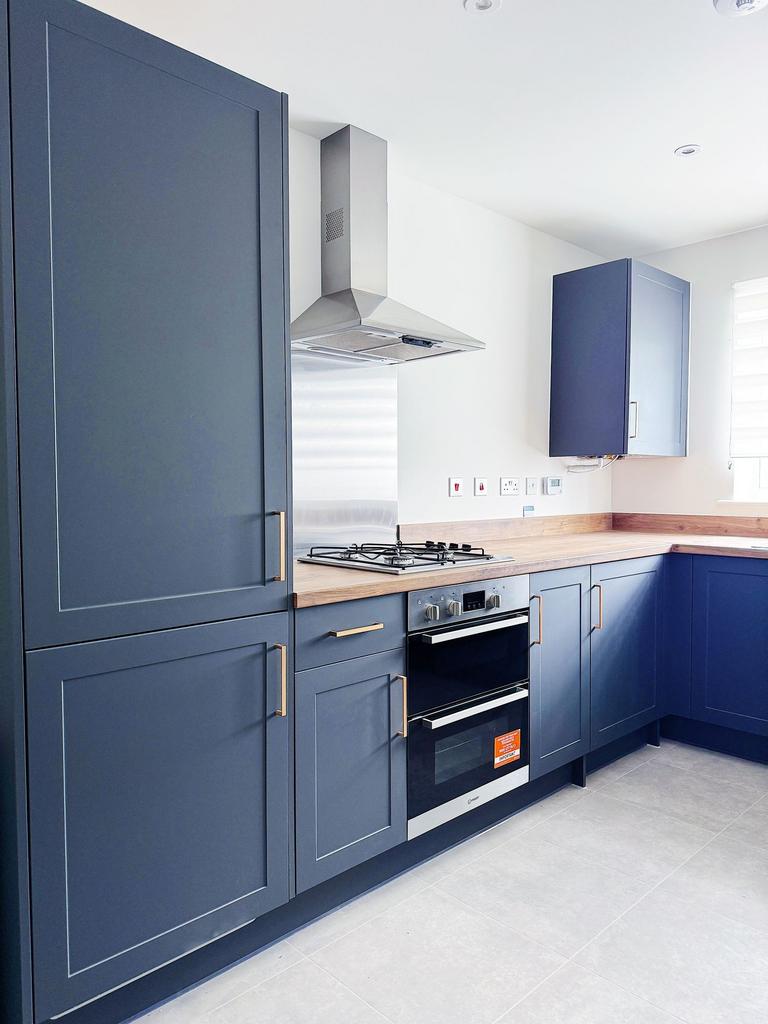 Contemporary kitchen with navy shaker cabinets,...