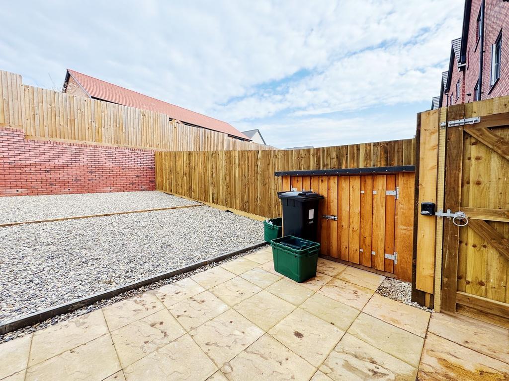 Private low-maintenance rear garden with paved ...
