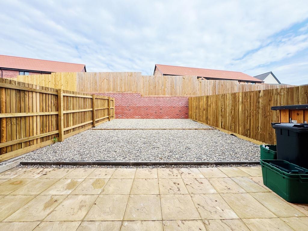 Private low-maintenance rear garden with paved ...