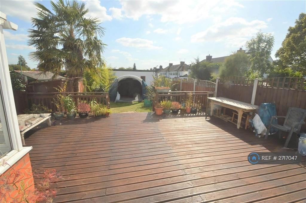 Garden And Garage At The End