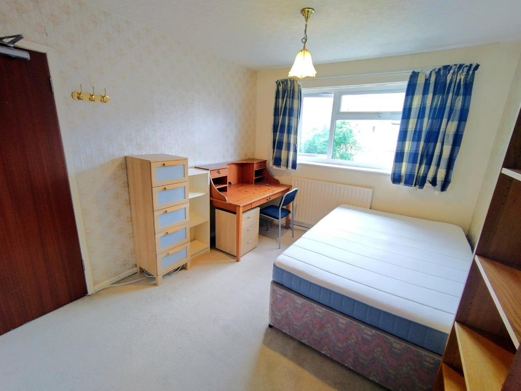 Bright, neatly presented bedroom with a double ...