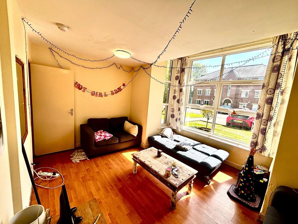 Bright and welcoming living room with large win...