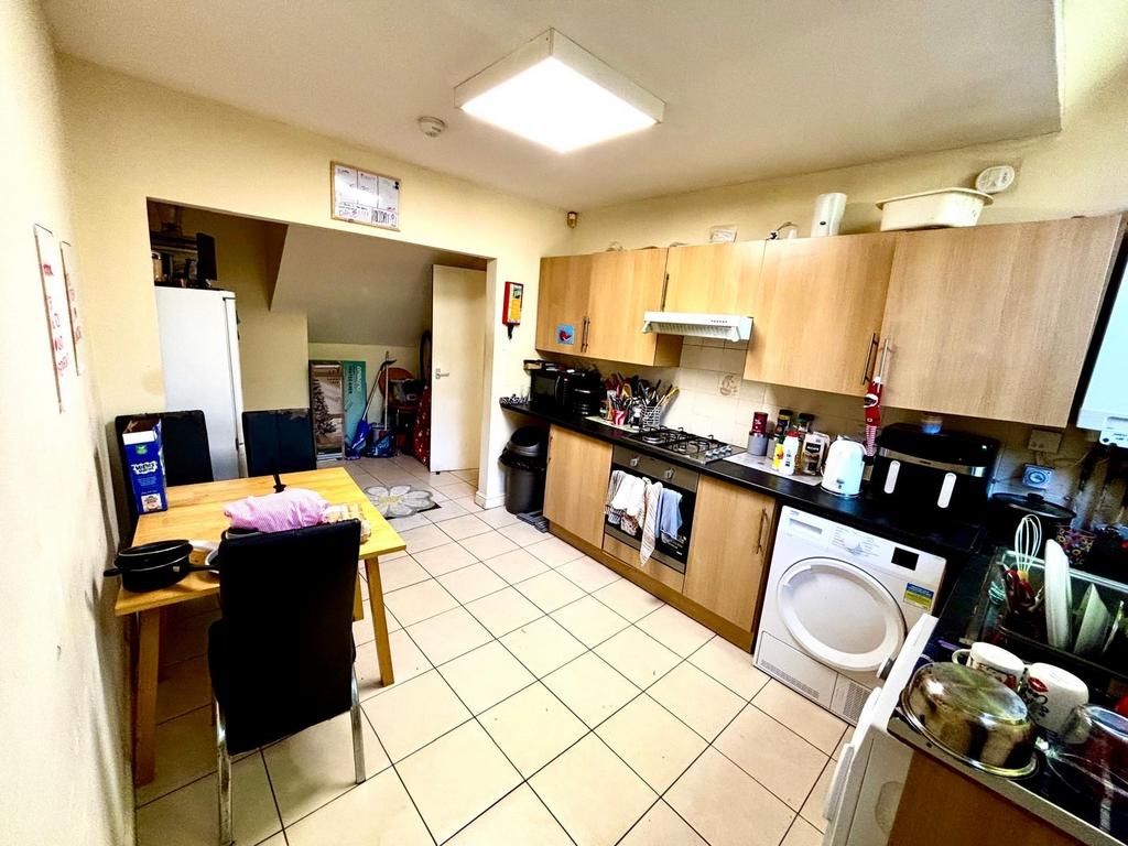 A practical and well-used kitchen featuring woo...