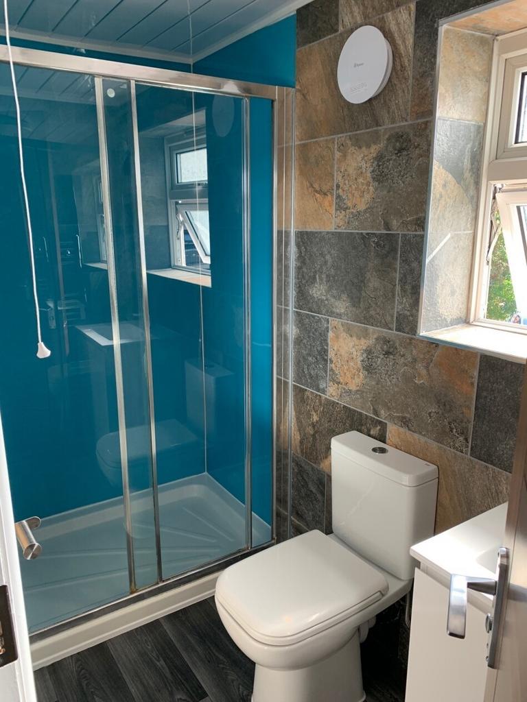 Bright and modern bathroom featuring a clean wh...