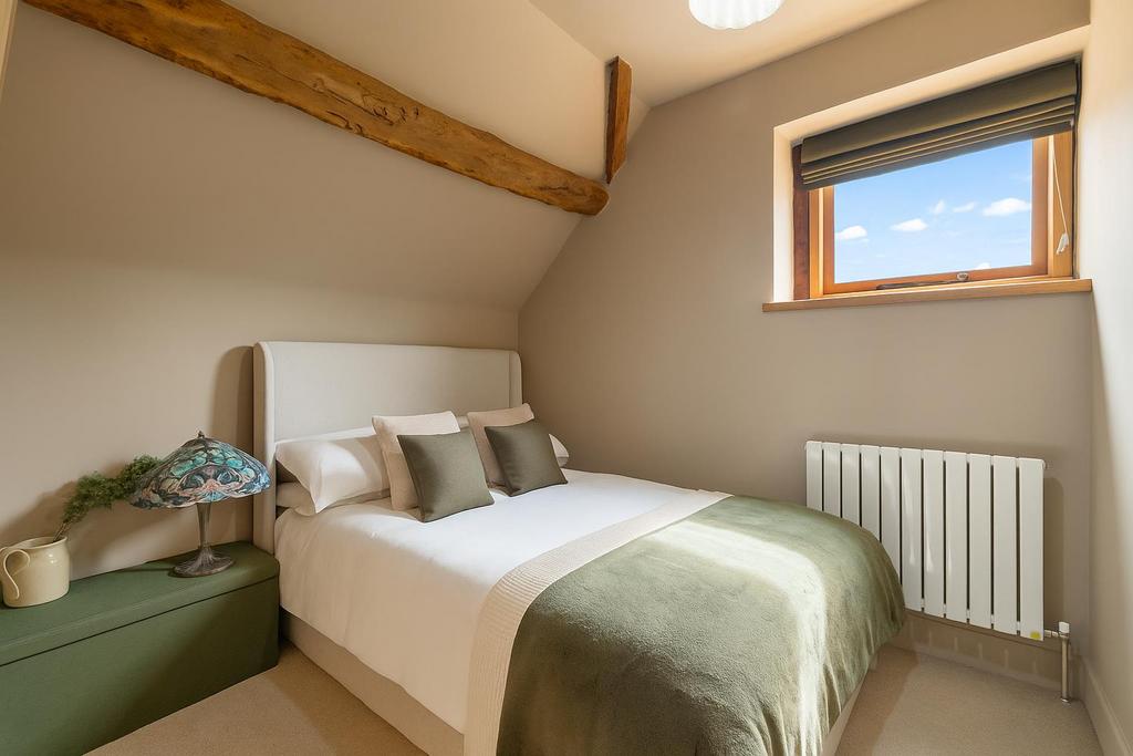 Cosy Attic Bedroom with Rustic Charm.png