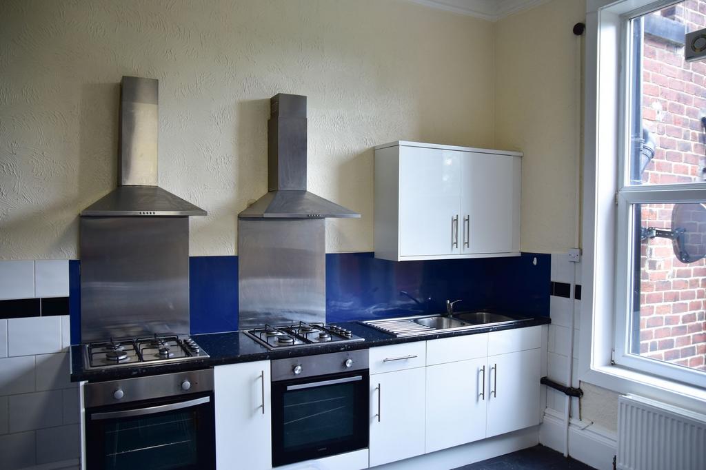 A modern kitchen featuring stainless steel appl...