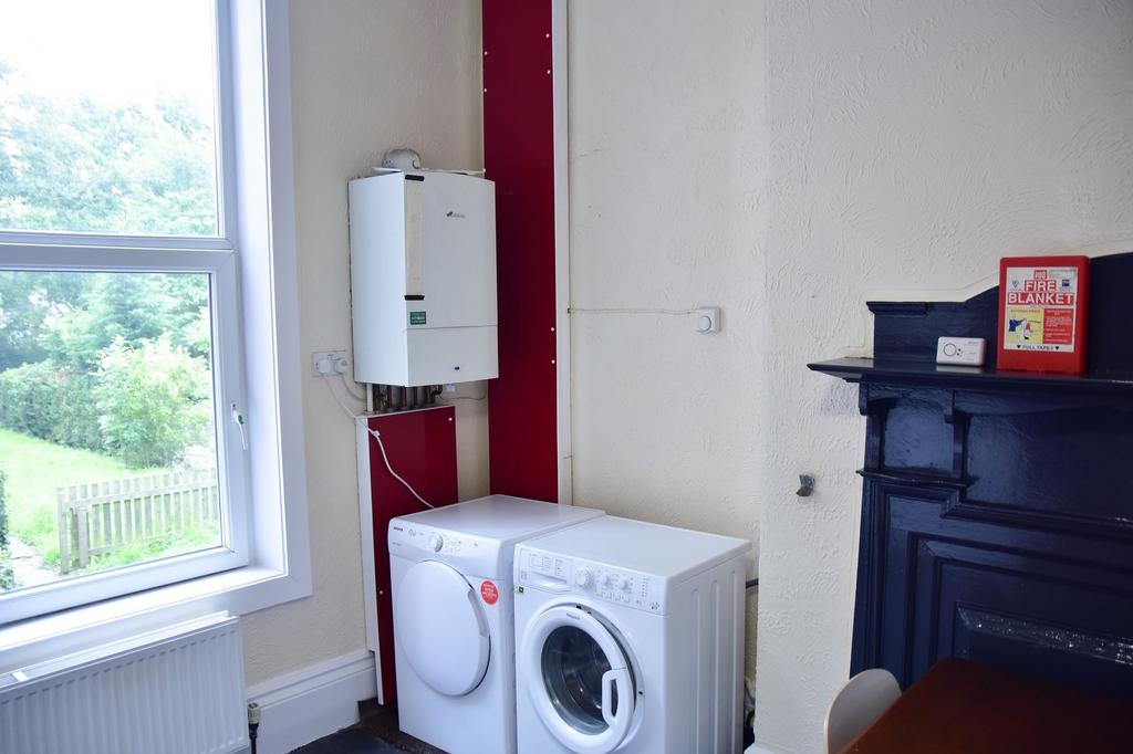 A functional kitchen area with a washing machin...